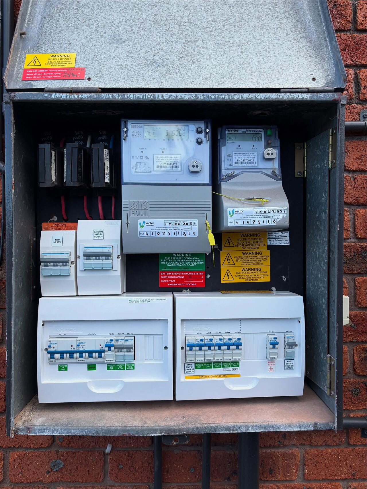 Home battery and solar inverter connected to a switchboard in Australia Home battery and solar inverter integrated into an upgraded residential switchboard with smart meters in an Australian home